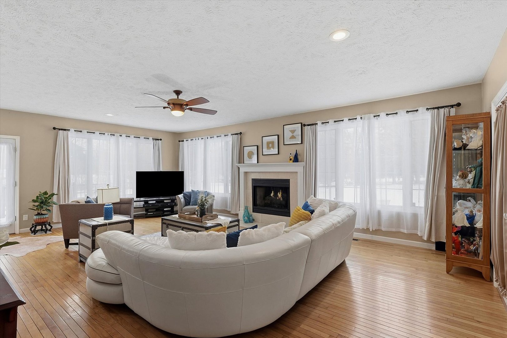 1307 Cross Creek Road Mahomet, IL 61853 - Photo 11 of 75 a living room with furniture and a fireplace