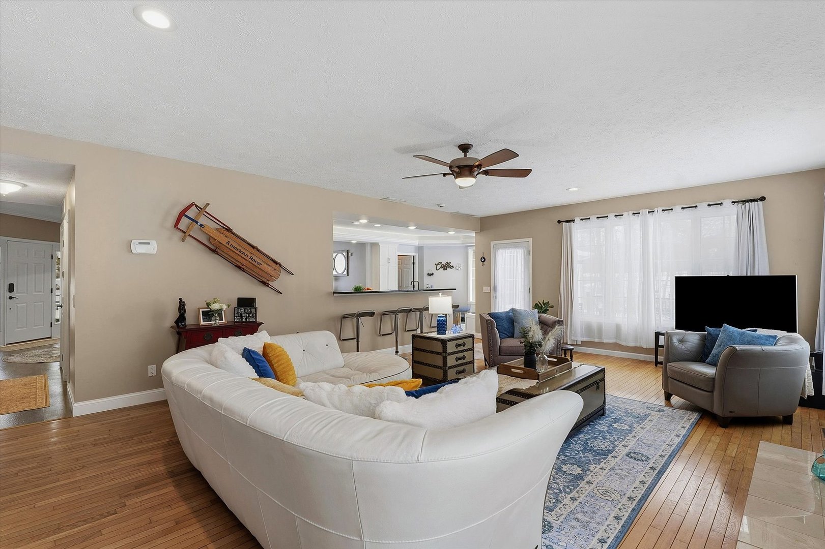 1307 Cross Creek Road Mahomet, IL 61853 - Photo 13 of 75 a living room with furniture and a flat screen tv