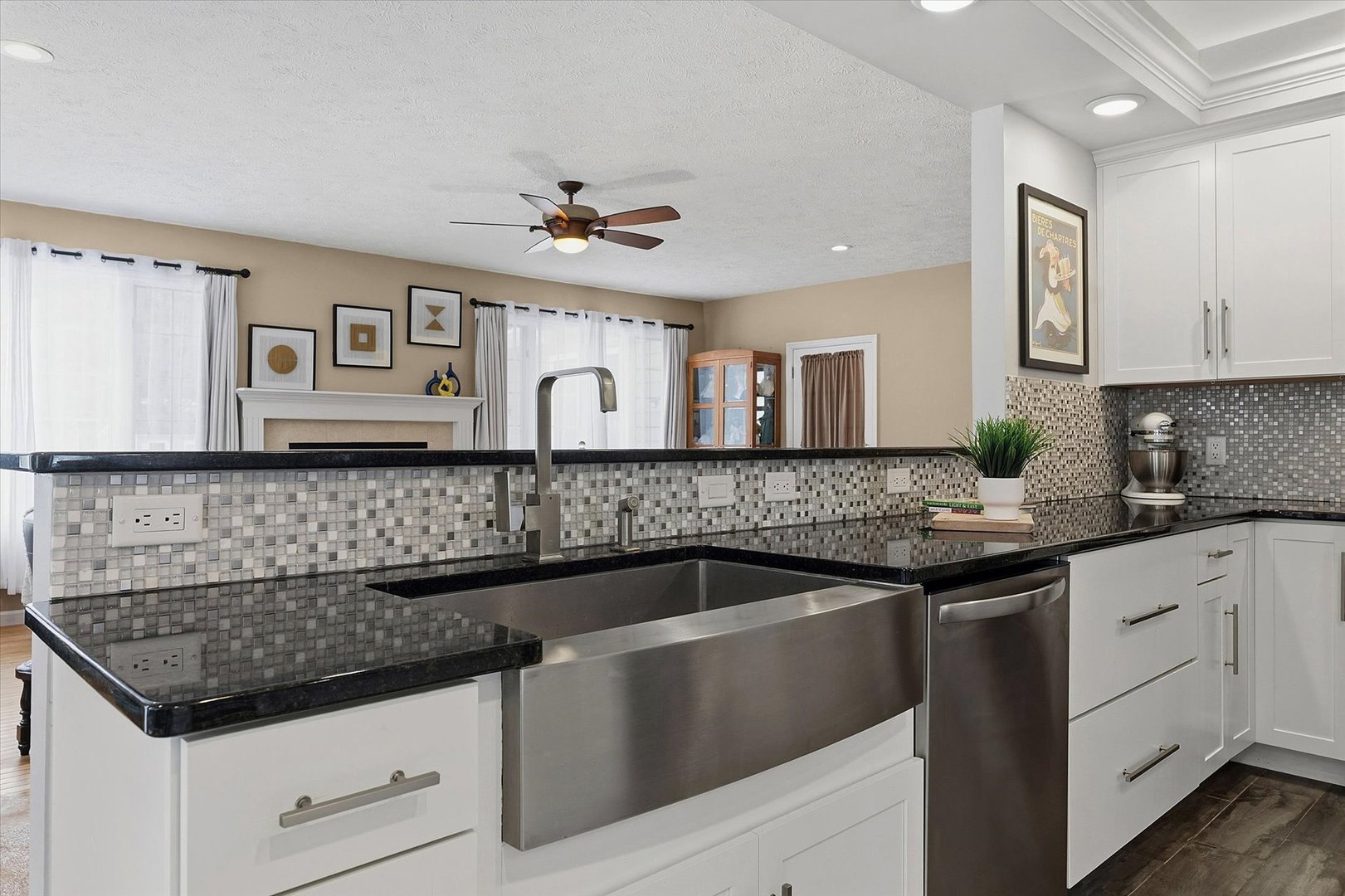 1307 Cross Creek Road Mahomet, IL 61853 - Photo 23 of 75 a kitchen with granite countertop a sink stainless steel appliances and white cabinets