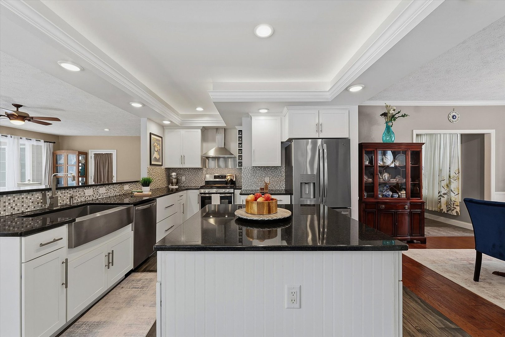 1307 Cross Creek Road Mahomet, IL 61853 - Photo 24 of 75 a kitchen with stainless steel appliances granite countertop a refrigerator and a sink