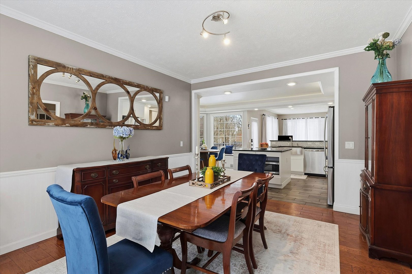 1307 Cross Creek Road Mahomet, IL 61853 - Photo 28 of 75 a view of a dining room with furniture and a kitchen