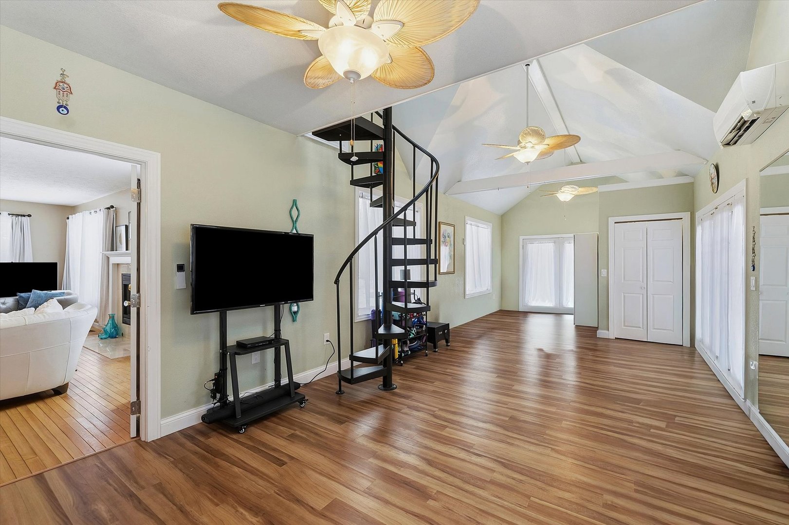 1307 Cross Creek Road Mahomet, IL 61853 - Photo 33 of 75 a view of a livingroom with wooden floor and a ceiling fan