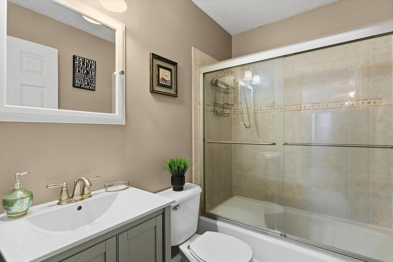 1307 Cross Creek Road Mahomet, IL 61853 - Photo 51 of 75 a bathroom with a sink toilet and shower