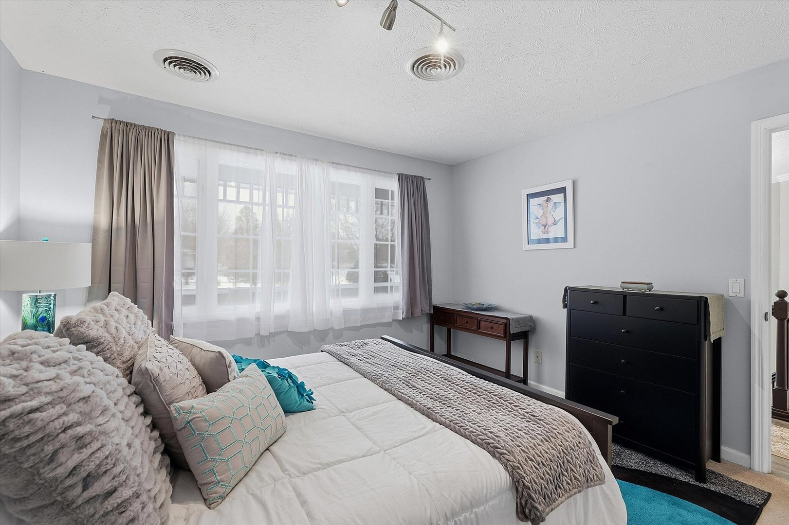 1307 Cross Creek Road Mahomet, IL 61853 - Photo 55 of 75 a bedroom with a bed and wooden floor
