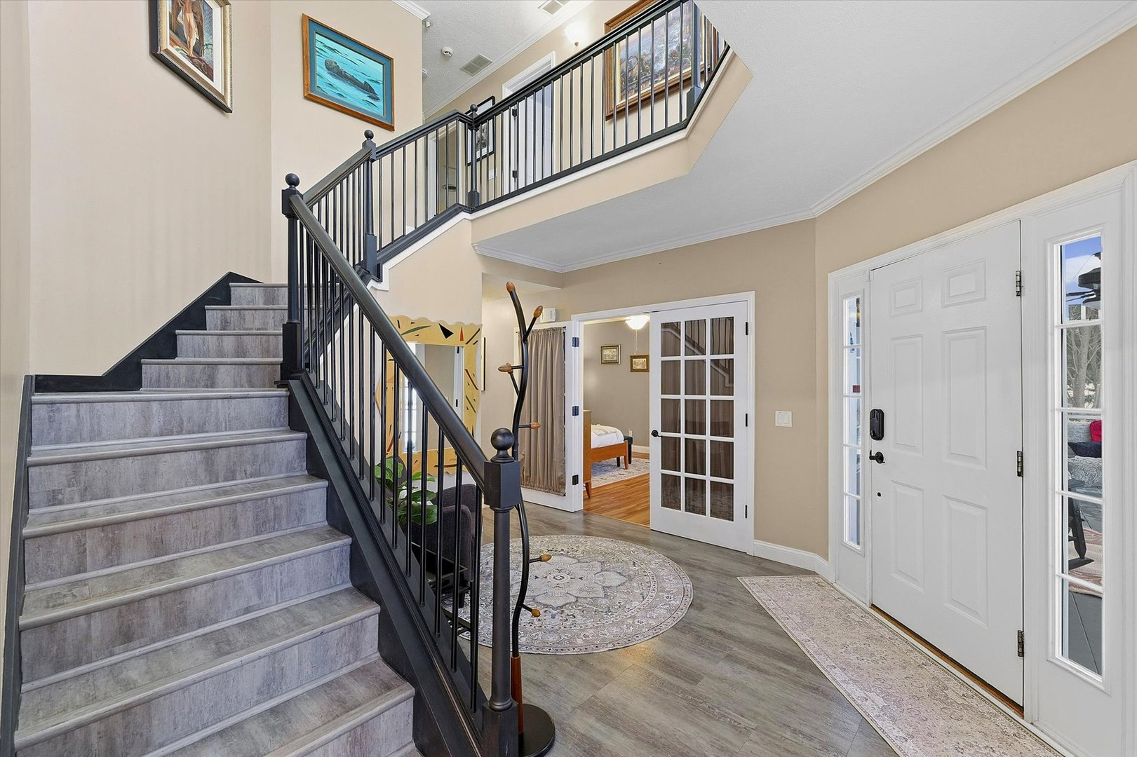 1307 Cross Creek Road Mahomet, IL 61853 - Photo 6 of 75 a view of entryway with wooden floor and stairs