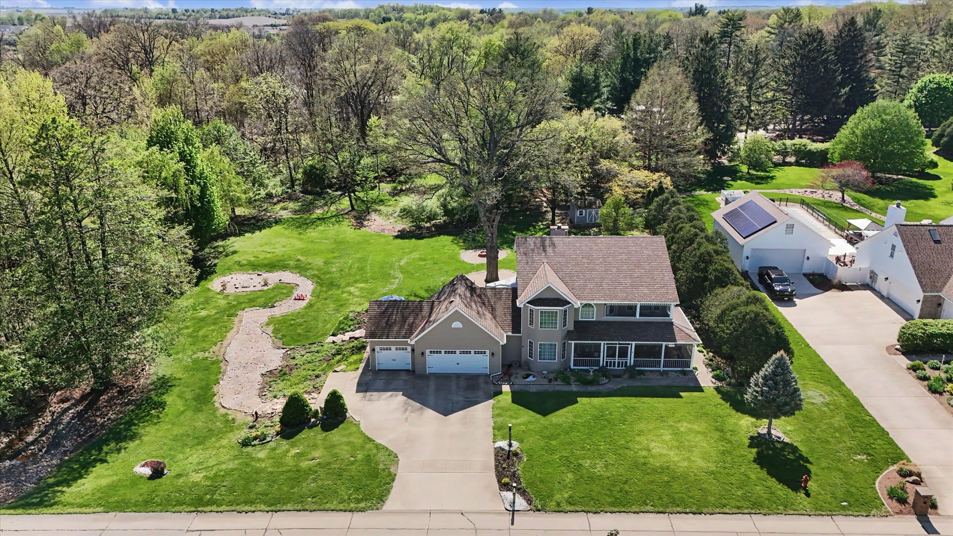 1307 Cross Creek Road Mahomet, IL 61853 - Photo 72 of 75 an aerial view of multiple houses with yard
