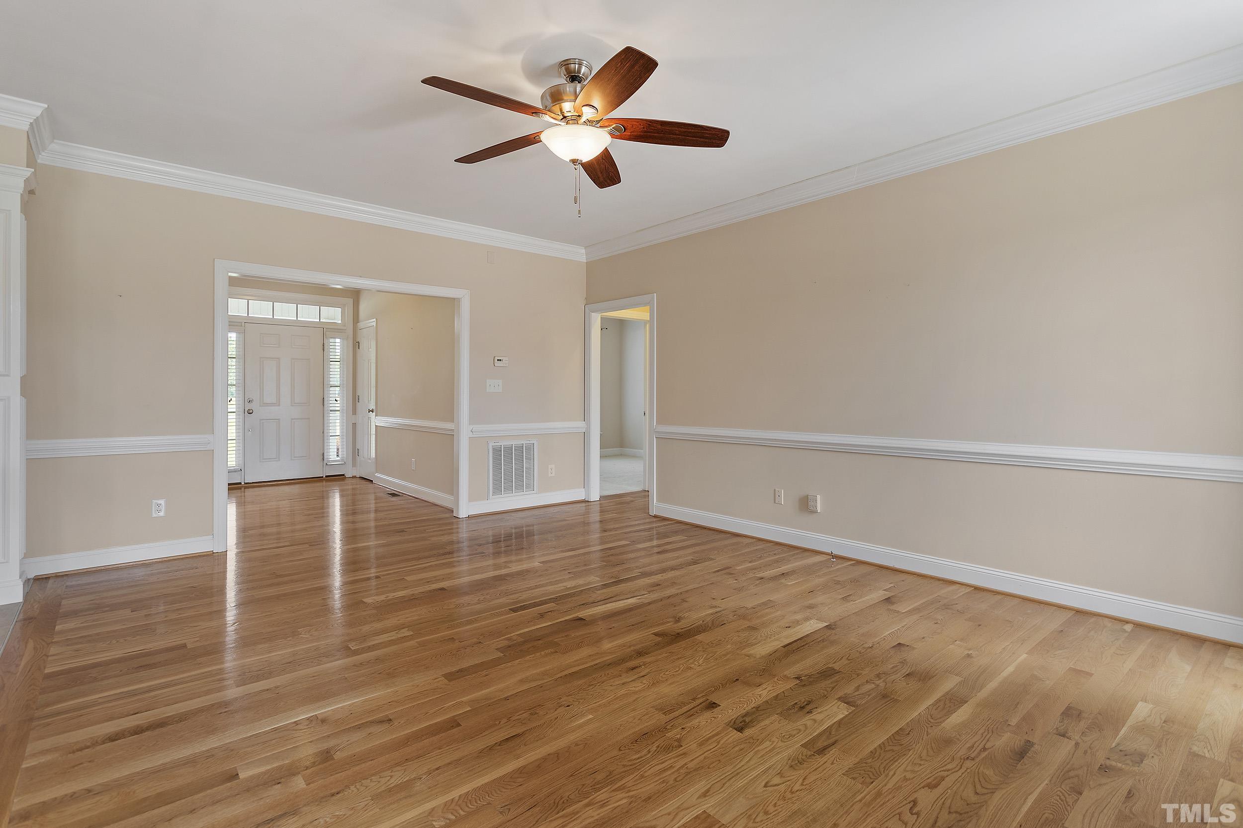 90 Fletcher Ridge Road Timberlake, NC 27583 - Photo 16 of 26 wooden floor in an empty room with a window