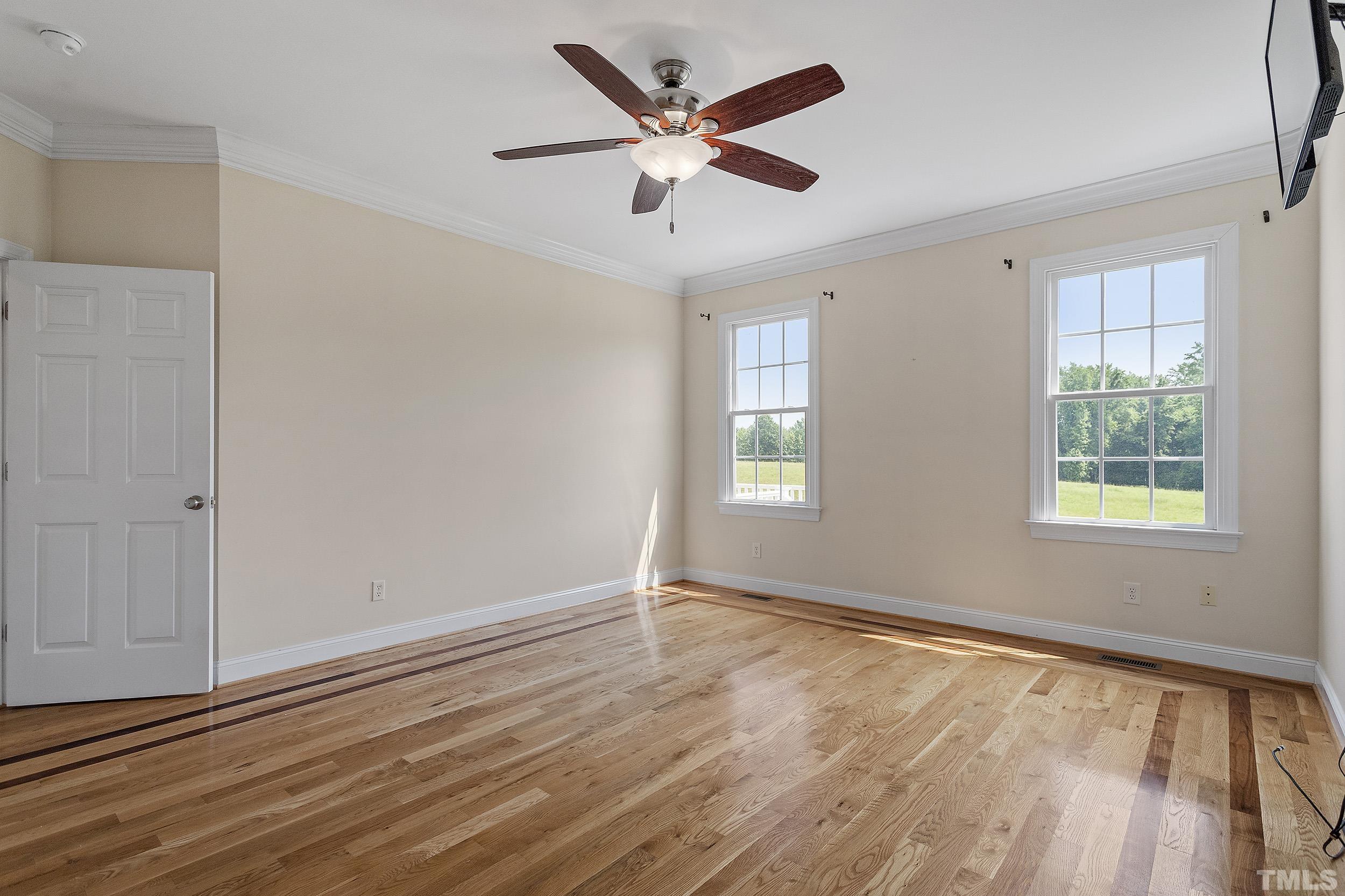 90 Fletcher Ridge Road Timberlake, NC 27583 - Photo 18 of 26 wooden floor in an empty room with a window
