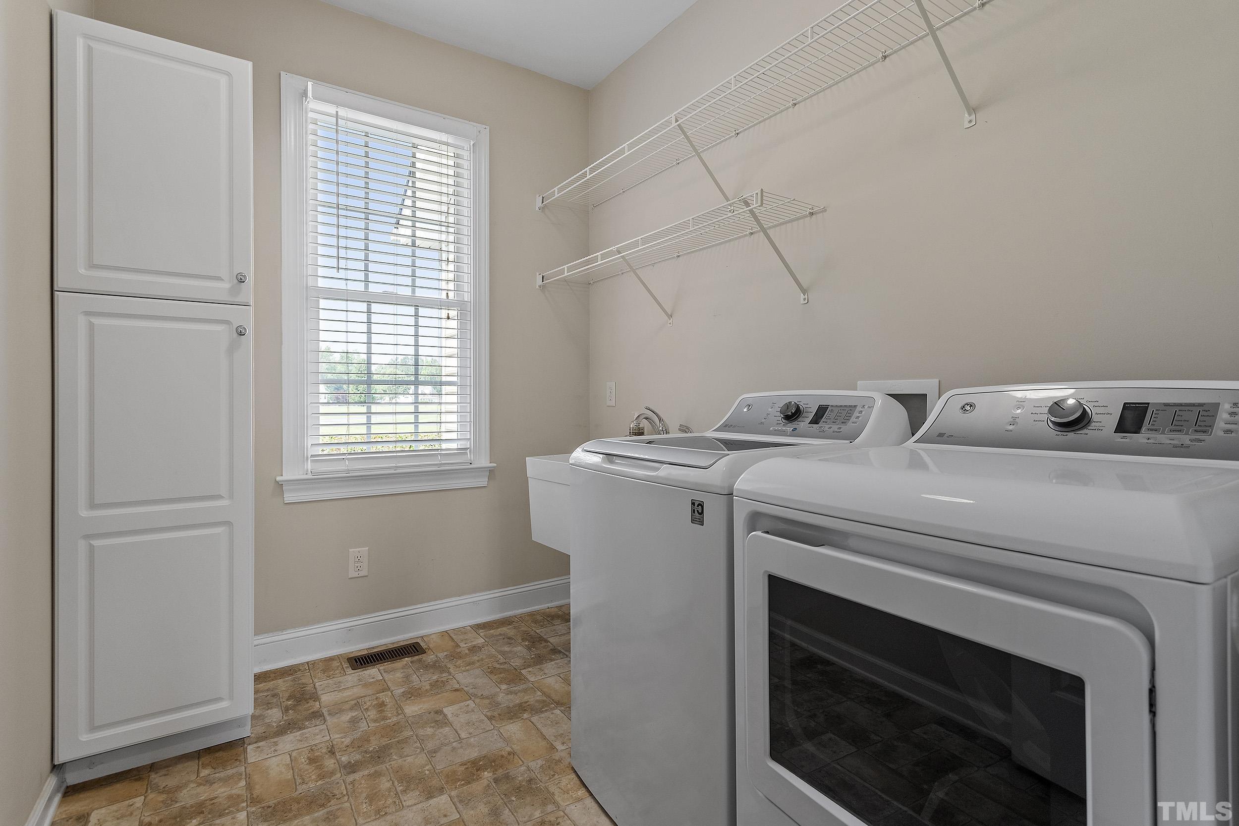 90 Fletcher Ridge Road Timberlake, NC 27583 - Photo 24 of 26 a utility room with dryer and washer