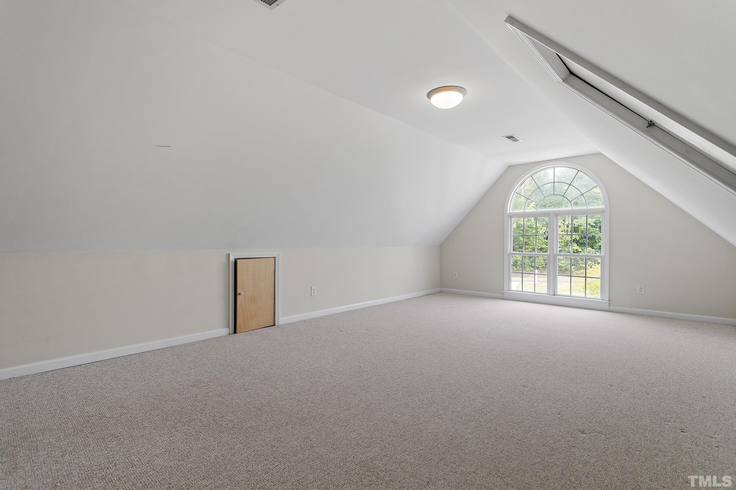 90 Fletcher Ridge Road Timberlake, NC 27583 - Photo 25 of 26 a view of a big room with windows and chandelier fan