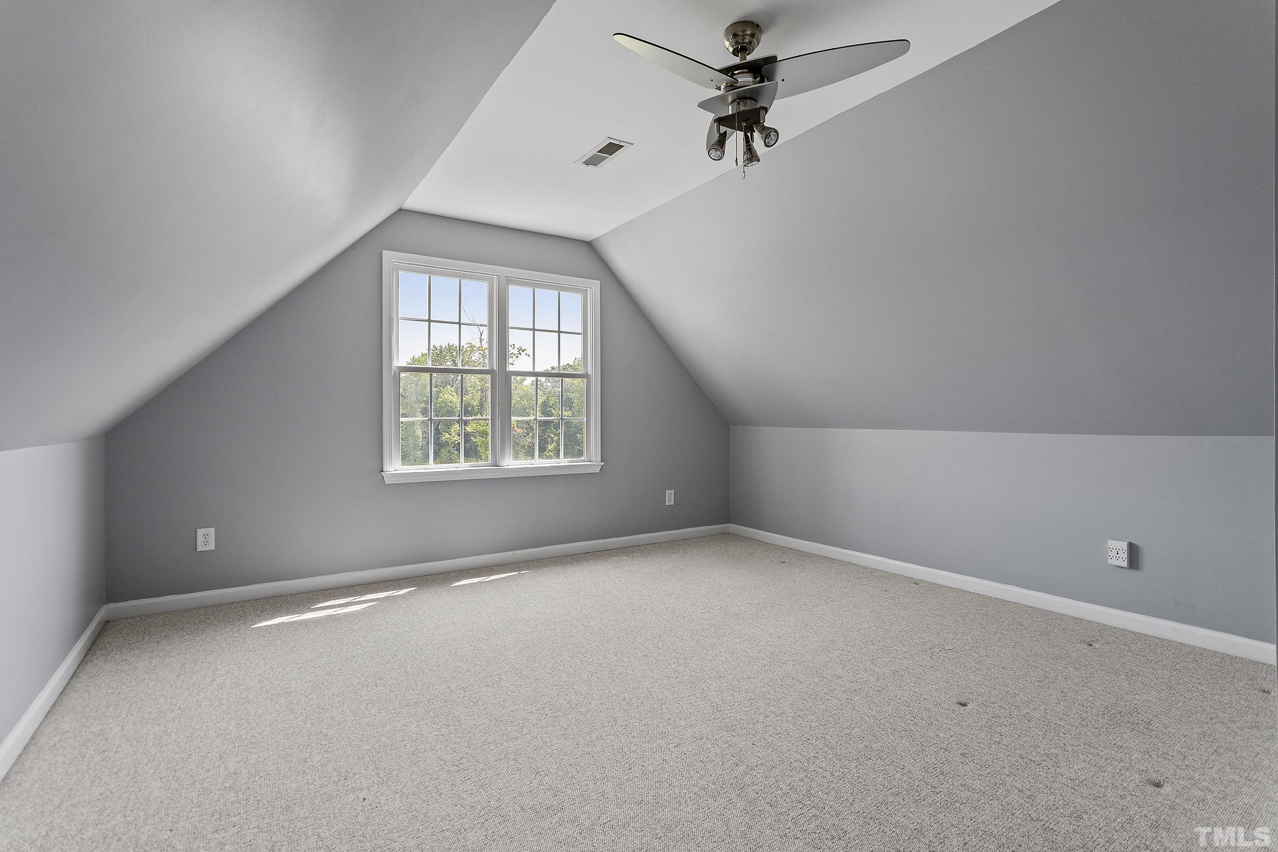 90 Fletcher Ridge Road Timberlake, NC 27583 - Photo 26 of 26 an empty room with a window and a fan