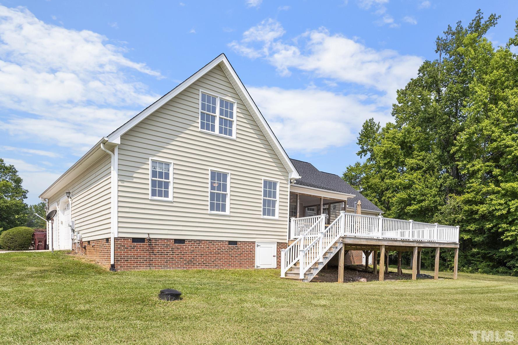 90 Fletcher Ridge Road Timberlake, NC 27583 - Photo 3 of 26 a front view of a house with a yard