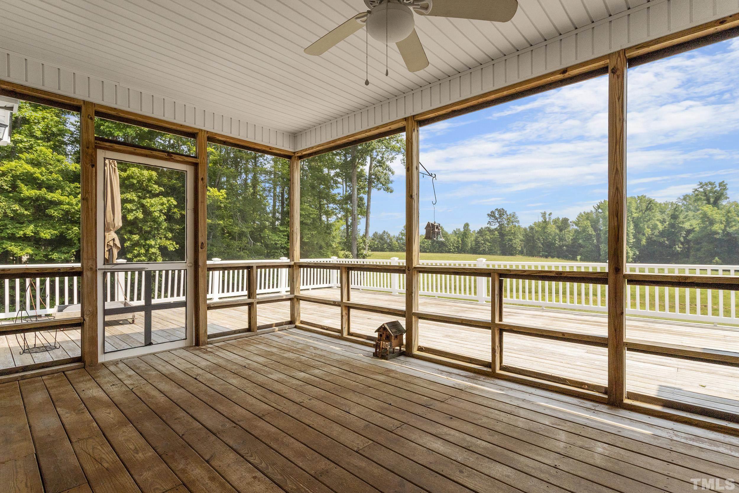 90 Fletcher Ridge Road Timberlake, NC 27583 - Photo 5 of 26 a view of a balcony with wooden floor