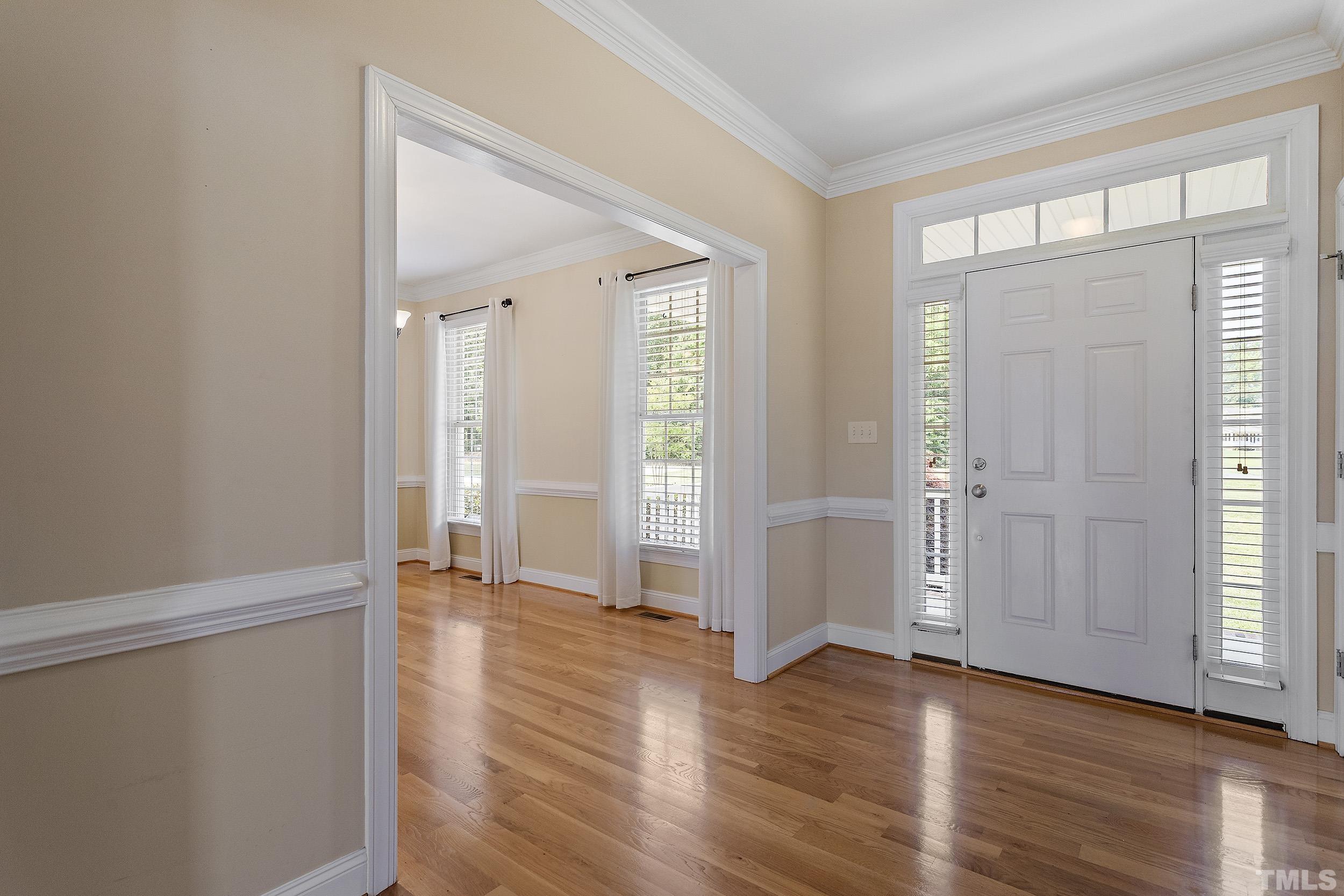 90 Fletcher Ridge Road Timberlake, NC 27583 - Photo 8 of 26 an empty room with wooden floor and windows