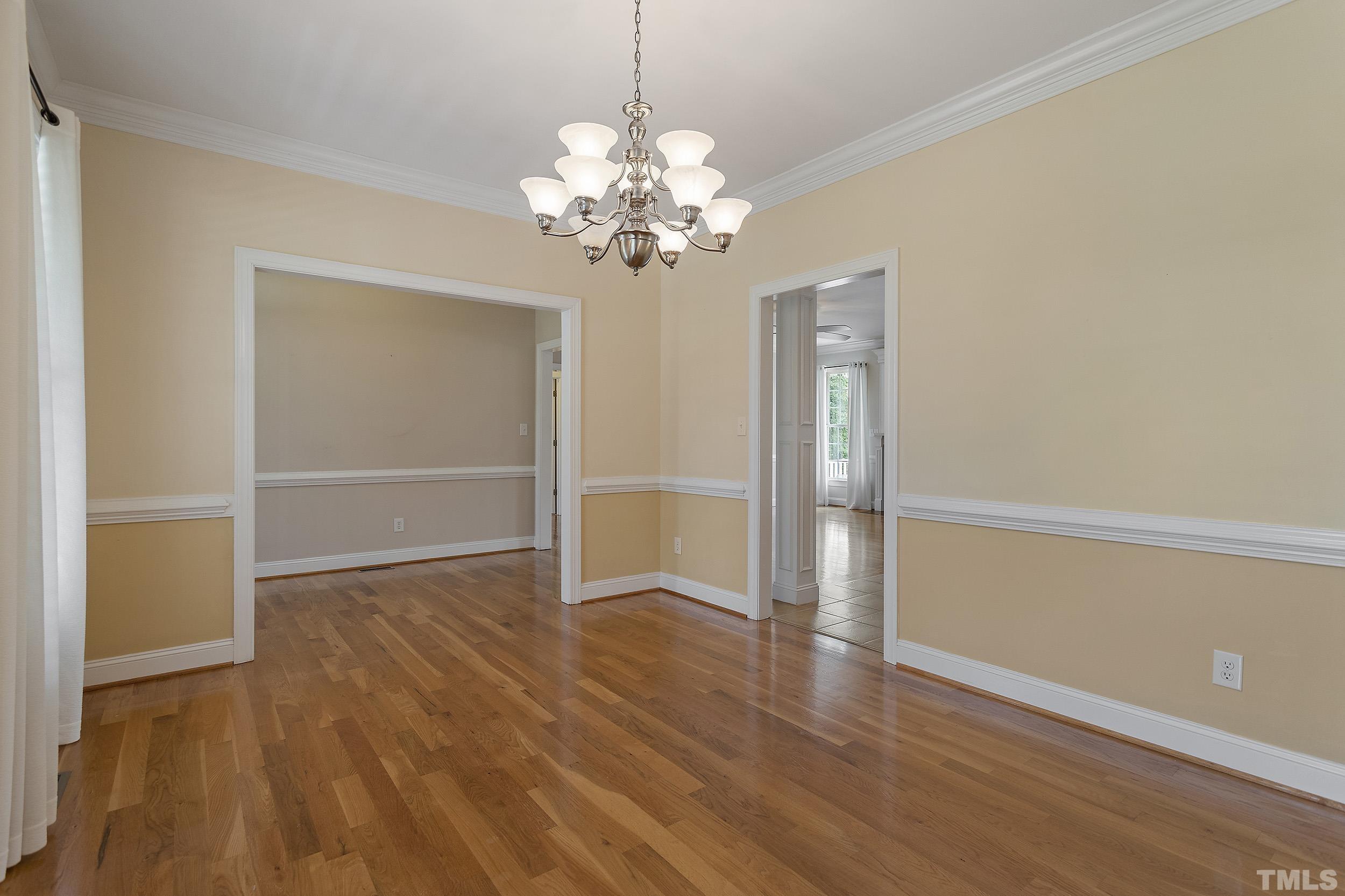 90 Fletcher Ridge Road Timberlake, NC 27583 - Photo 9 of 26 a view of an empty room with wooden floor