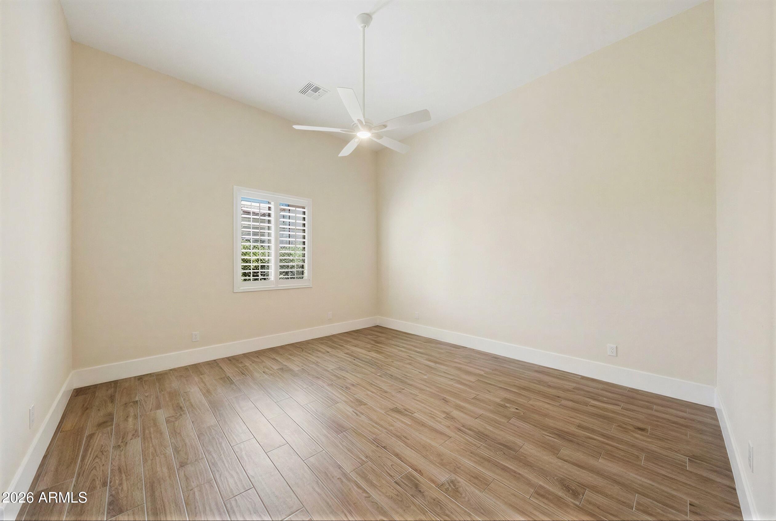 8974 North 8th Lane Phoenix, AZ 85021 - Photo 15 of 29 wooden floor in an empty room with a window