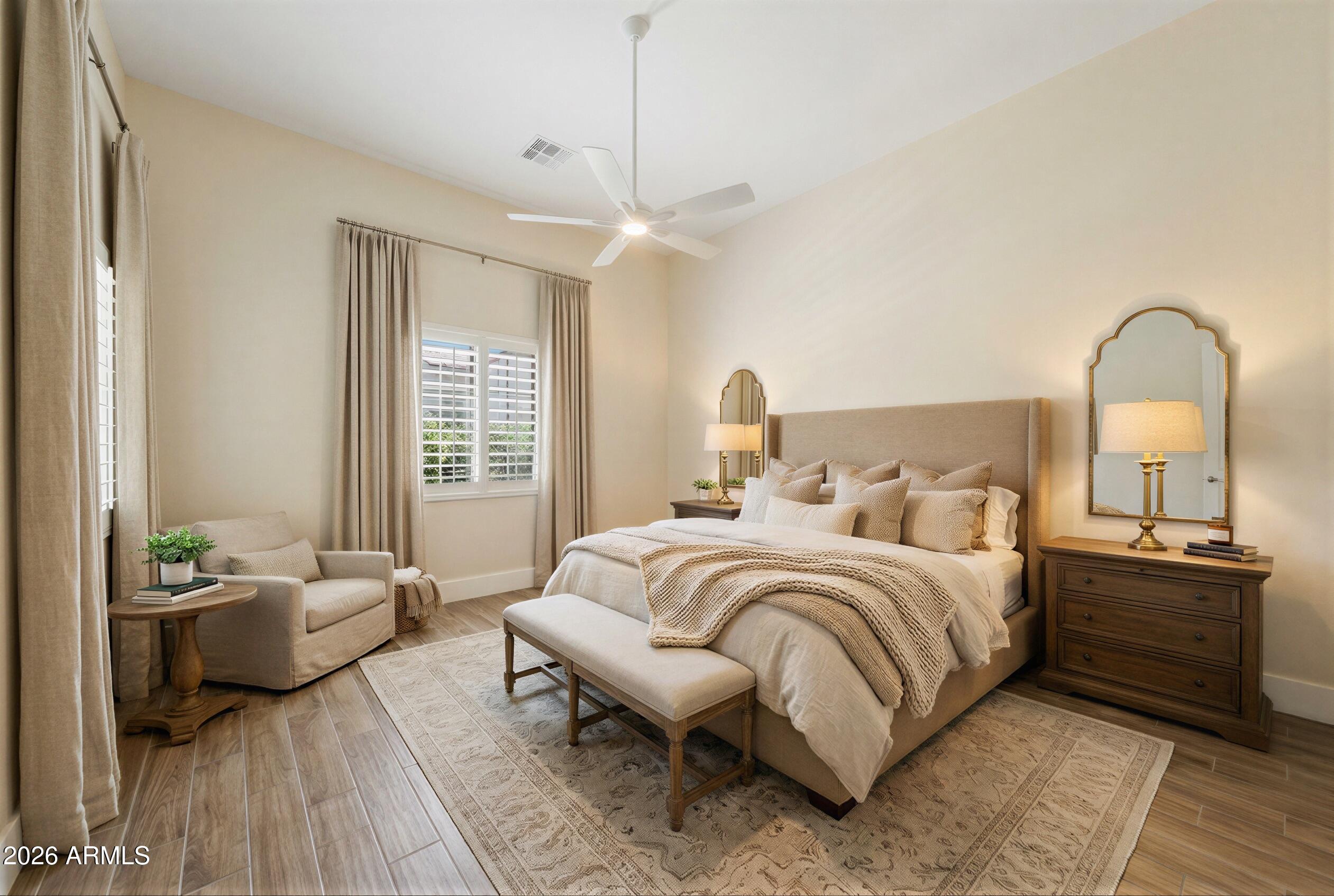 8974 North 8th Lane Phoenix, AZ 85021 - Photo 16 of 29 a bedroom with a bed wooden floor and window