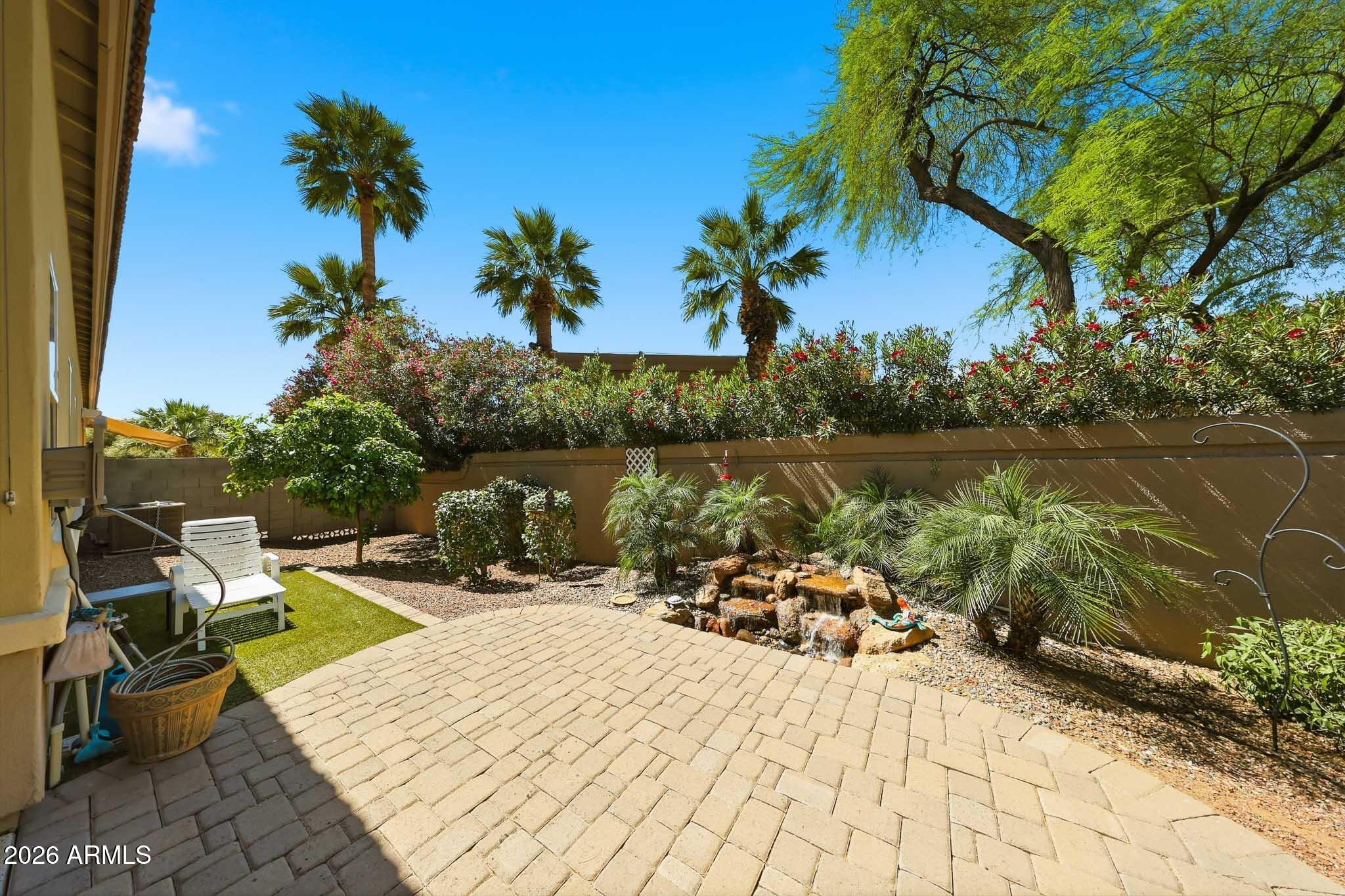8974 North 8th Lane Phoenix, AZ 85021 - Photo 27 of 29 a view of a lake with couches chairs under an umbrella