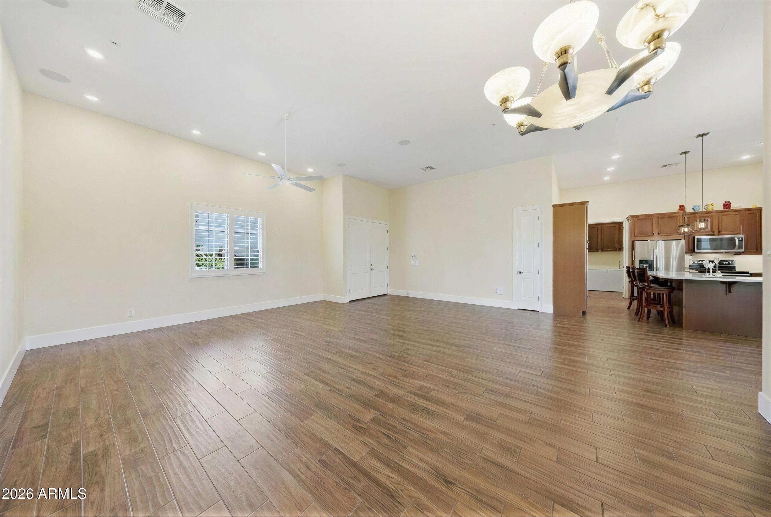 8974 North 8th Lane Phoenix, AZ 85021 - Photo 5 of 29 a view of kitchen and hall with wooden floor