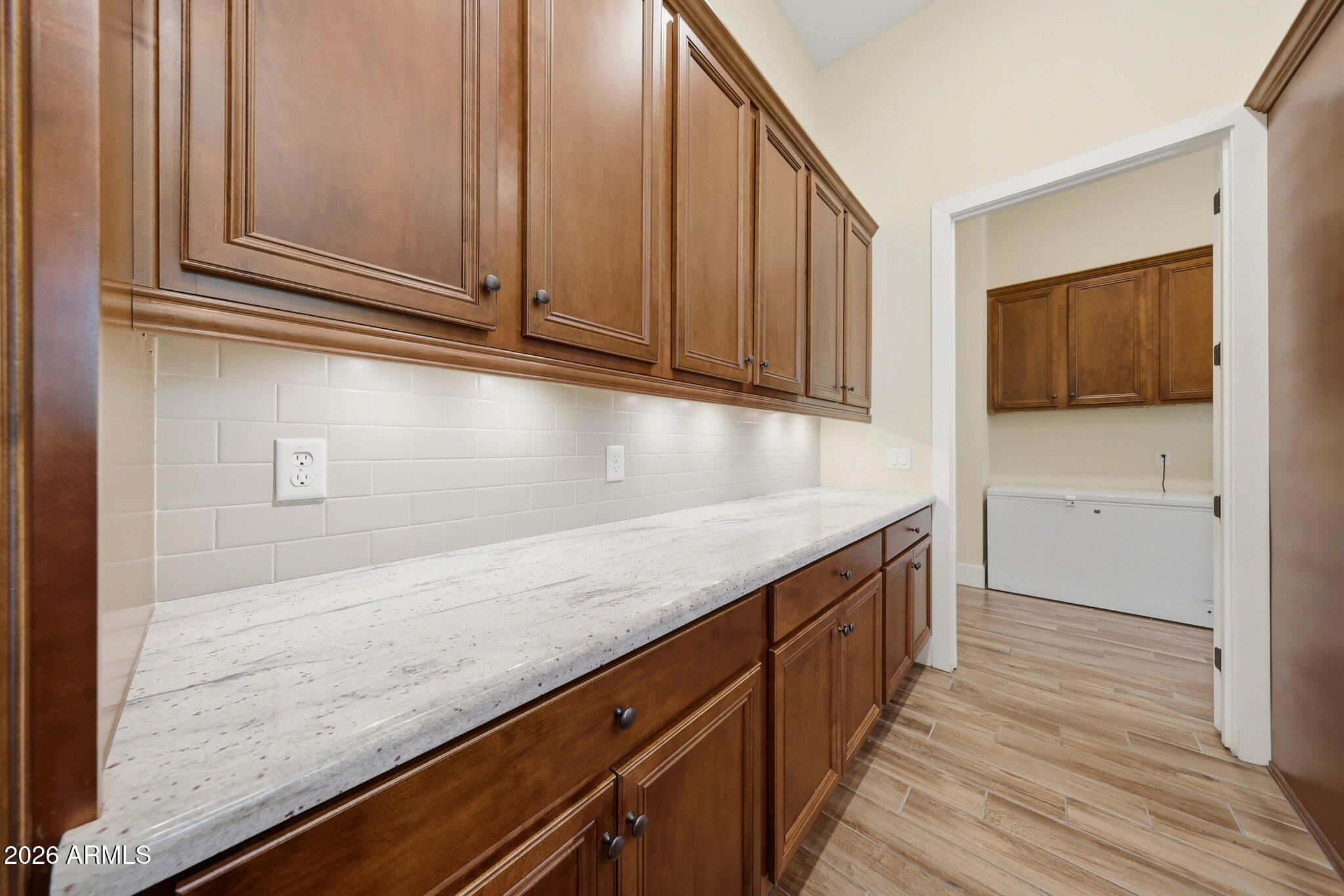 8974 North 8th Lane Phoenix, AZ 85021 - Photo 10 of 29 a kitchen with granite countertop cabinets stainless steel appliances wooden floor and a window