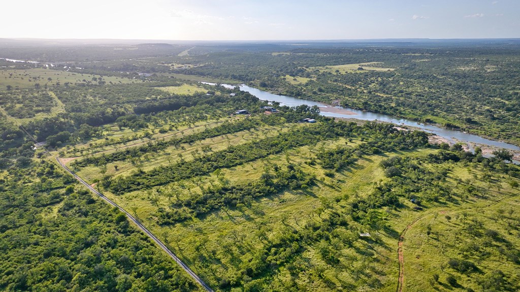 610 Ranch Road 152, Unit 4 Mason, TX 76856 - Photo 24 of 48 an aerial view of residential houses with outdoor space and trees