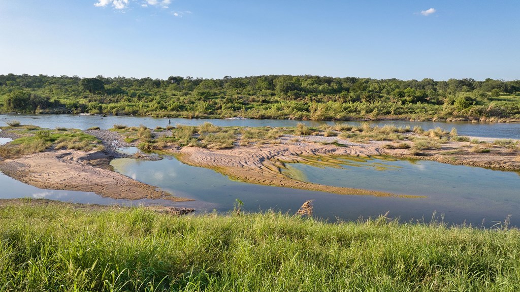 610 Ranch Road 152, Unit 4 Mason, TX 76856 - Photo 31 of 48 an aerial view of residential houses with outdoor space and lake view