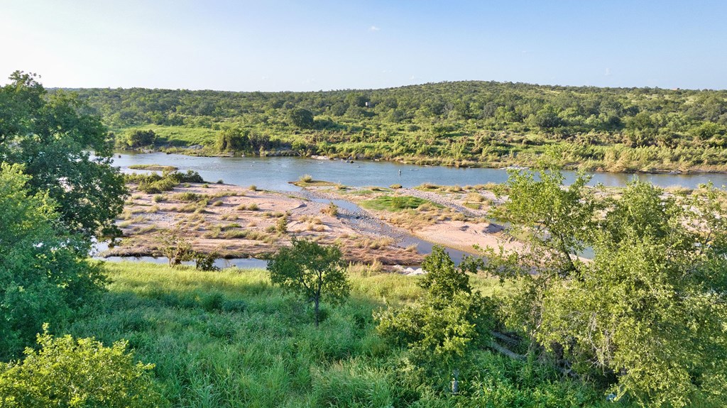 610 Ranch Road 152, Unit 4 Mason, TX 76856 - Photo 7 of 48 a view of a lake with mountains in the background