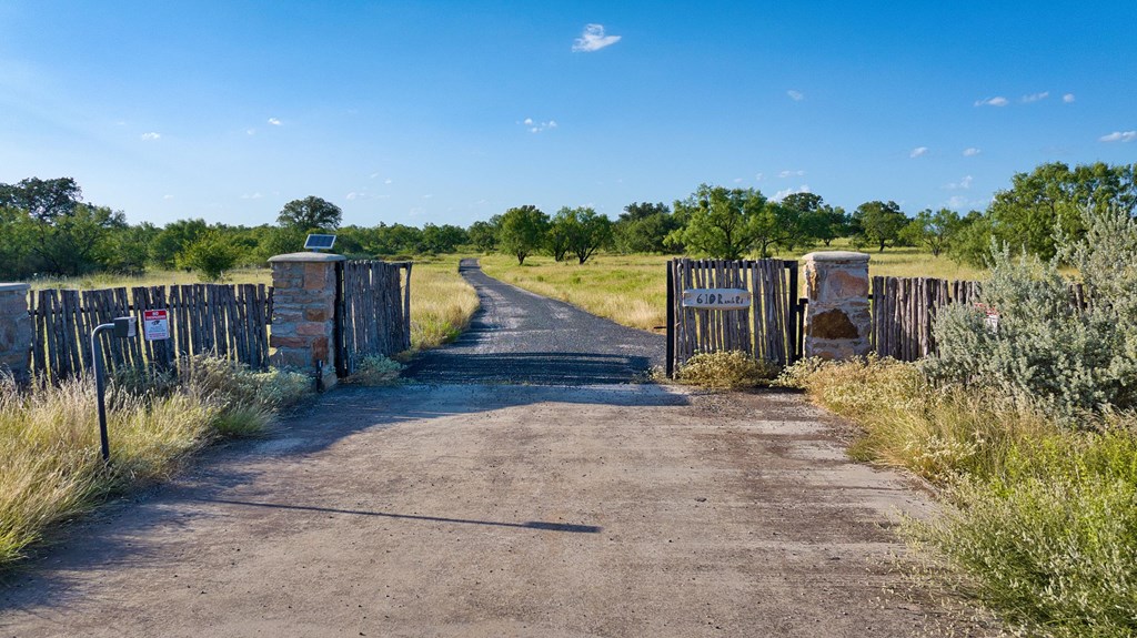 610 Ranch Road 152, Unit 4 Mason, TX 76856 - Photo 8 of 48 a view of a pathway with a wrought fence