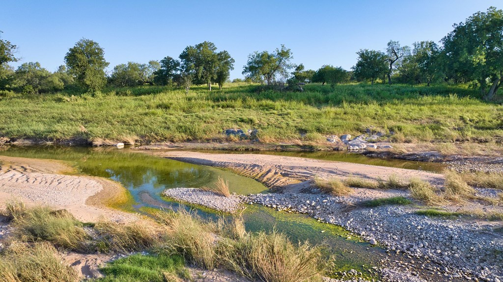610 Ranch Road 152, Unit 4 Mason, TX 76856 - Photo 10 of 48 a view of a lake with houses in all around