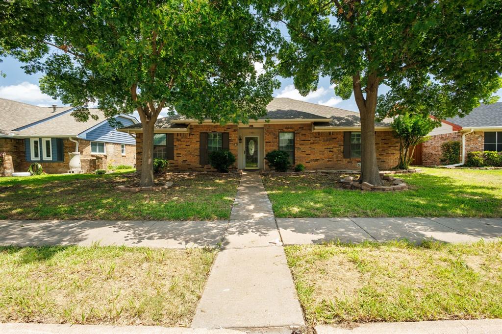 7305 Ridgeview Drive Rowlett, TX 75089 - Photo 1 of 32 a front view of a house with a yard