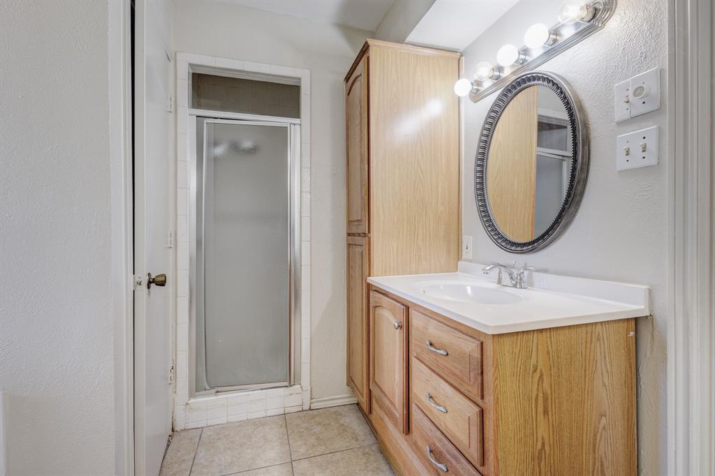 7305 Ridgeview Drive Rowlett, TX 75089 - Photo 12 of 32 a bathroom with a sink and a mirror