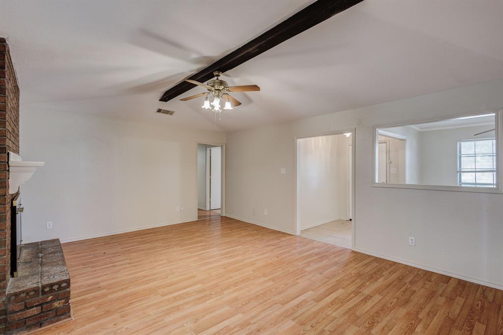 7305 Ridgeview Drive Rowlett, TX 75089 - Photo 17 of 32 wooden floor in an empty room with a window