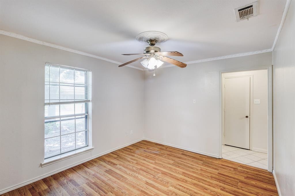 7305 Ridgeview Drive Rowlett, TX 75089 - Photo 29 of 32 wooden floor in an empty room with a window