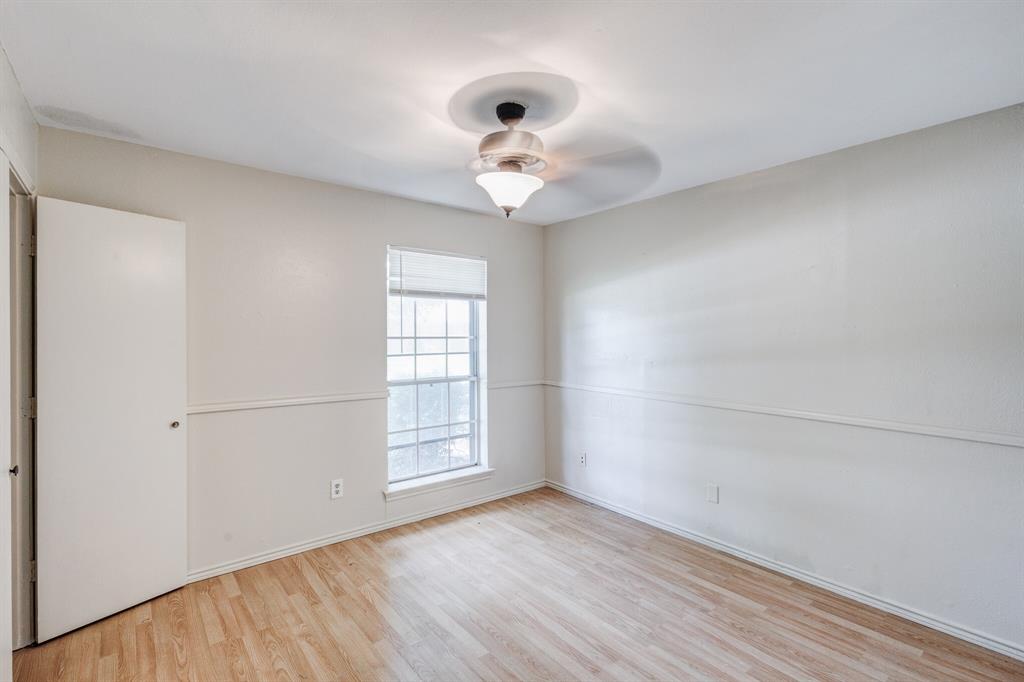 7305 Ridgeview Drive Rowlett, TX 75089 - Photo 32 of 32 wooden floor in an empty room with a window
