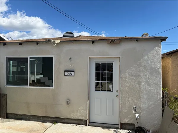 a view of a house with a door and a window