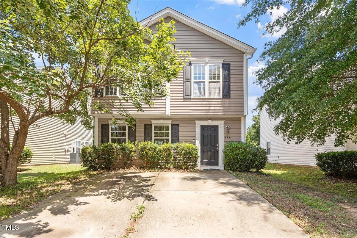 a view of a house with a yard