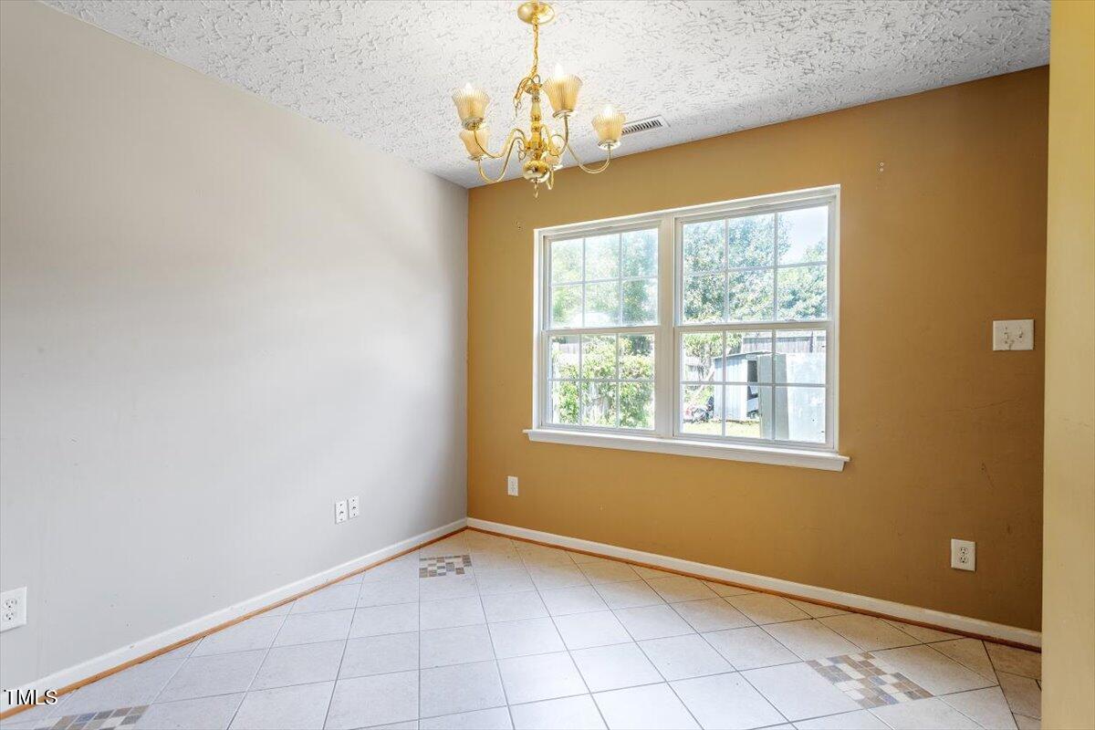 4221 Tensity Drive Raleigh, NC 27604 - Photo 14 of 31 a view of an empty room with a window