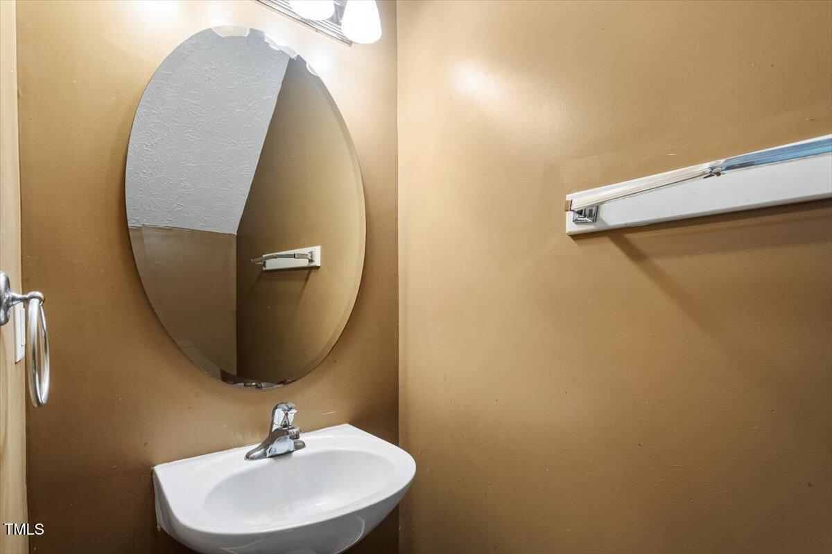 4221 Tensity Drive Raleigh, NC 27604 - Photo 15 of 31 a bathroom with a sink and mirror