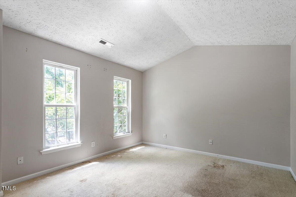 4221 Tensity Drive Raleigh, NC 27604 - Photo 16 of 31 an empty room with windows