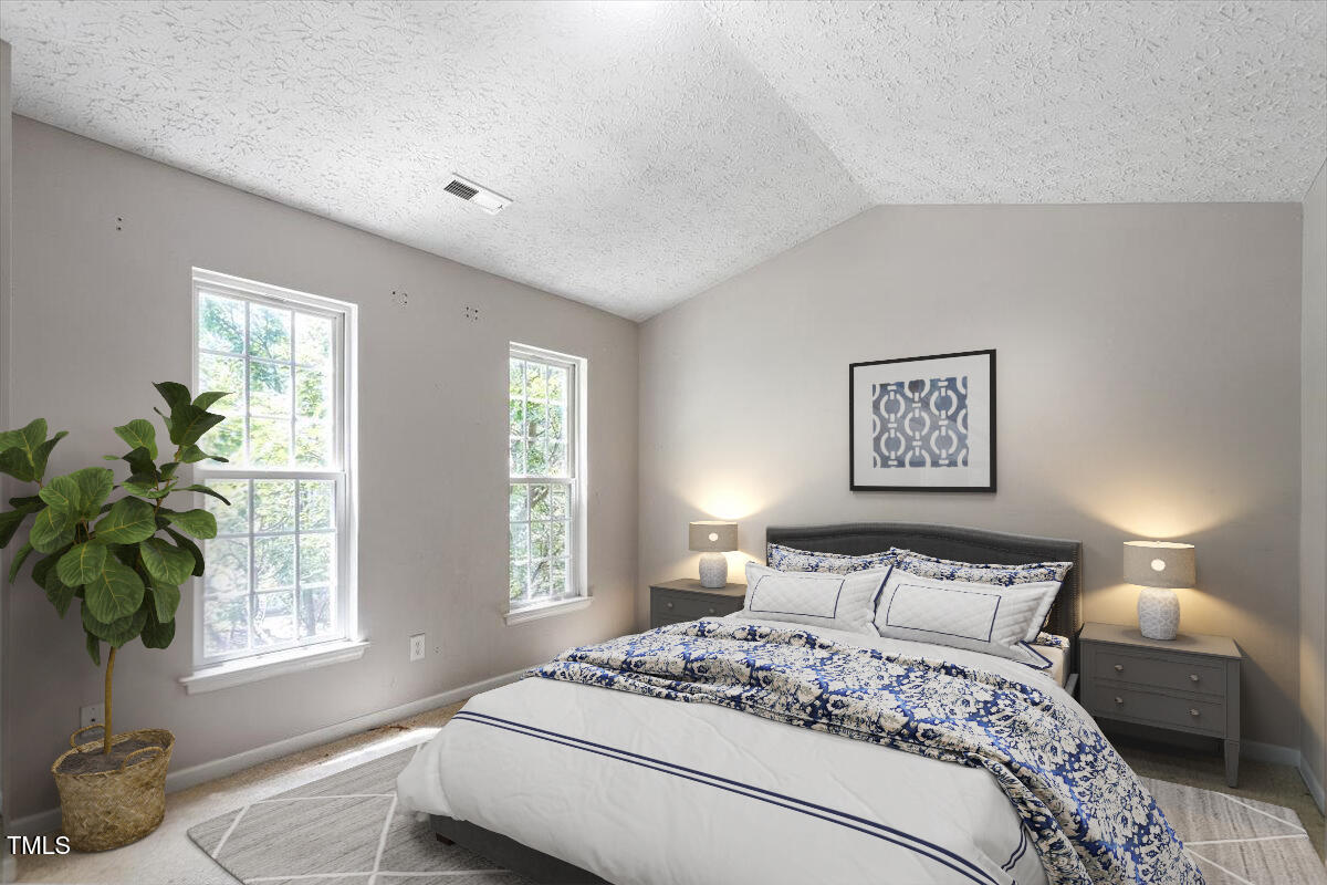 4221 Tensity Drive Raleigh, NC 27604 - Photo 17 of 31 a bedroom with a bed and a window