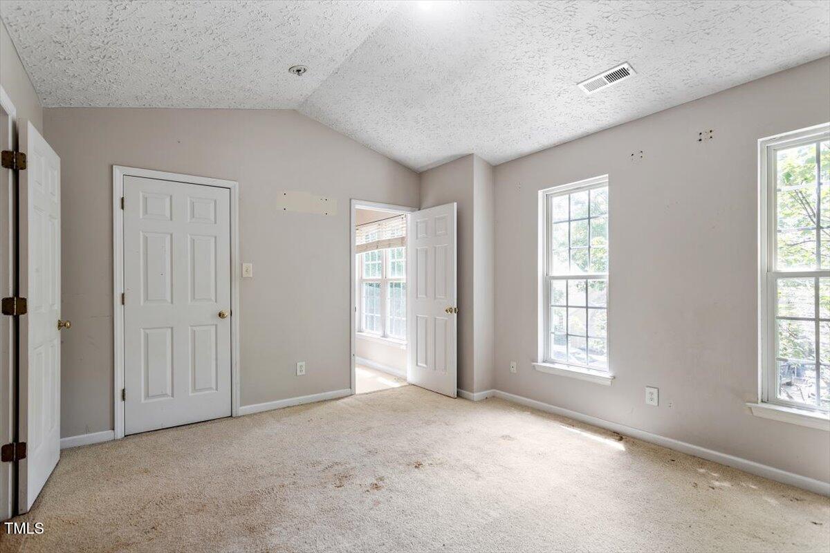 4221 Tensity Drive Raleigh, NC 27604 - Photo 18 of 31 a view of an empty room with windows