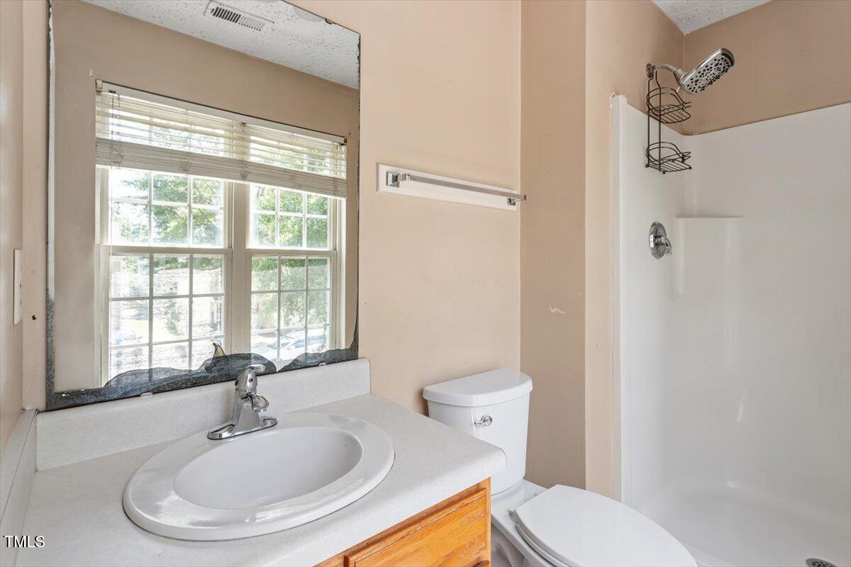 4221 Tensity Drive Raleigh, NC 27604 - Photo 19 of 31 a bathroom with a sink toilet and shower