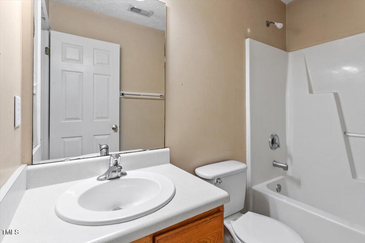 4221 Tensity Drive Raleigh, NC 27604 - Photo 21 of 31 a bathroom with a sink toilet and shower