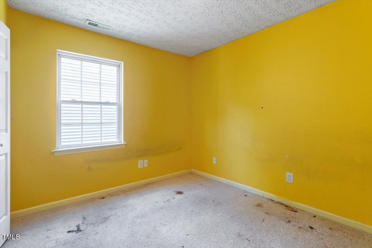 4221 Tensity Drive Raleigh, NC 27604 - Photo 22 of 31 a view of a blue wall with a large window