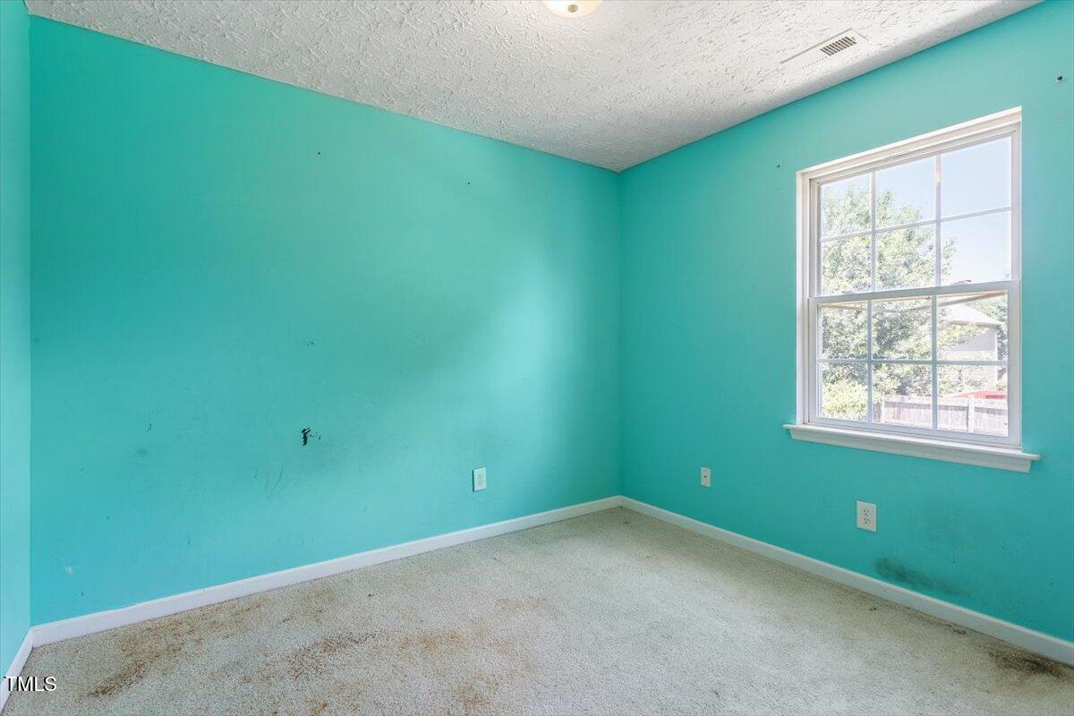 4221 Tensity Drive Raleigh, NC 27604 - Photo 25 of 31 a view of an empty room with a window
