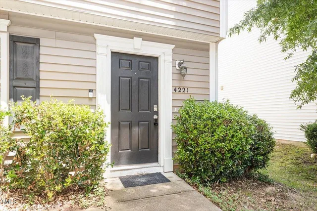 a view of house with backyard