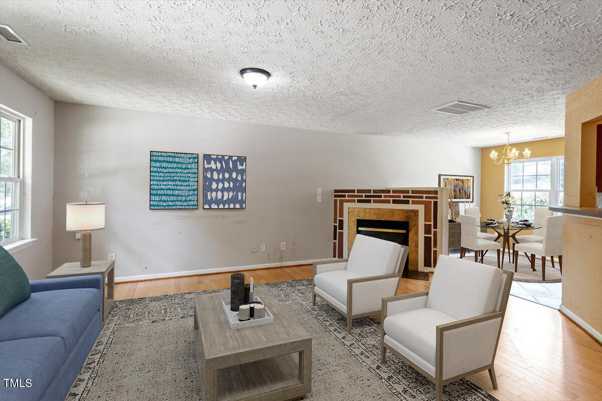 4221 Tensity Drive Raleigh, NC 27604 - Photo 5 of 31 a living room with furniture and a fireplace