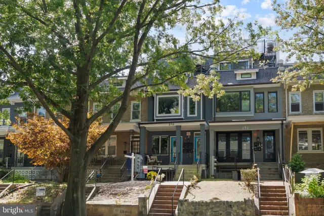 a front view of a building with street view