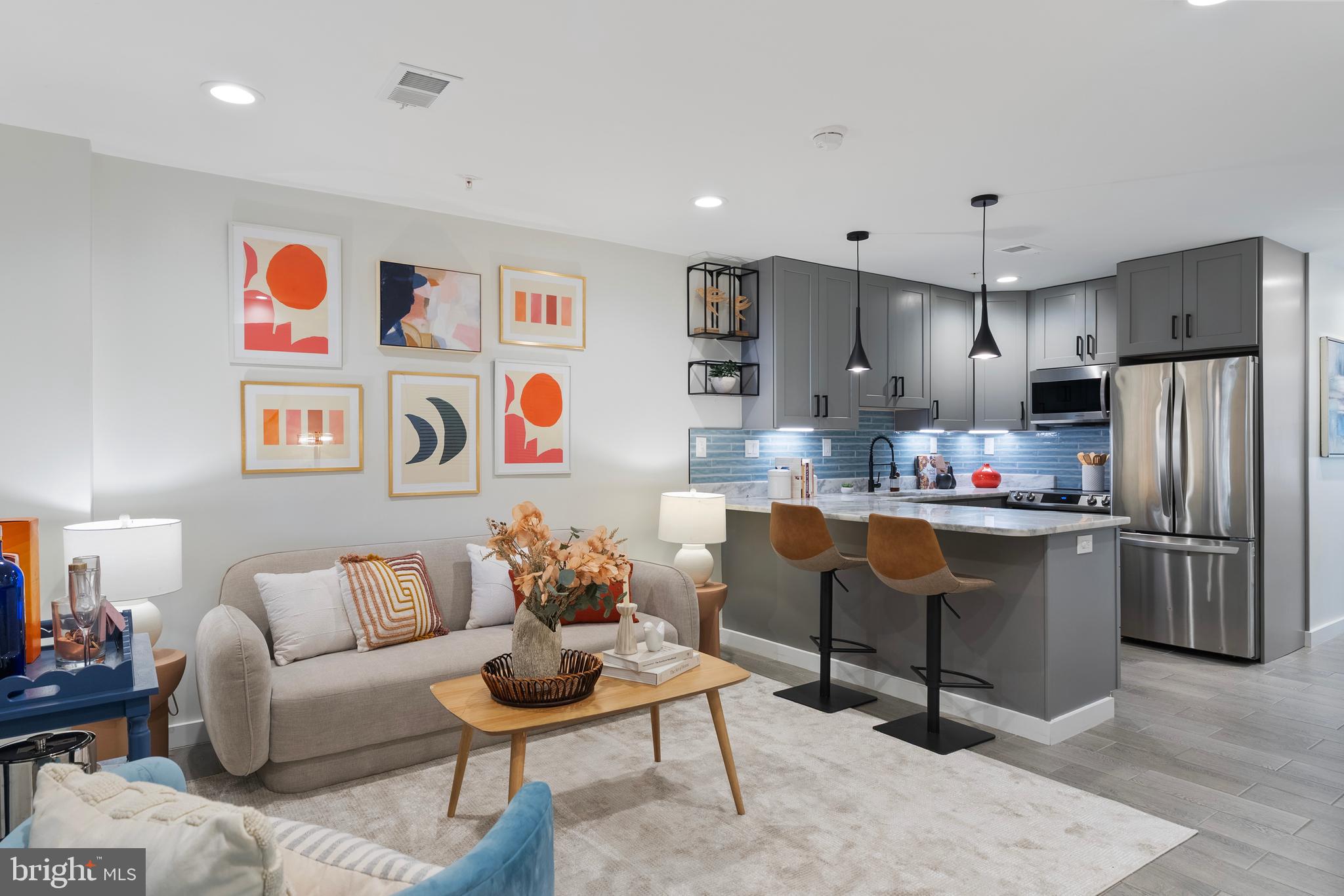 210 Varnum Street Northwest, Unit 1 Washington, DC 20011 - Photo 11 of 22 a living room with stainless steel appliances furniture and a kitchen view