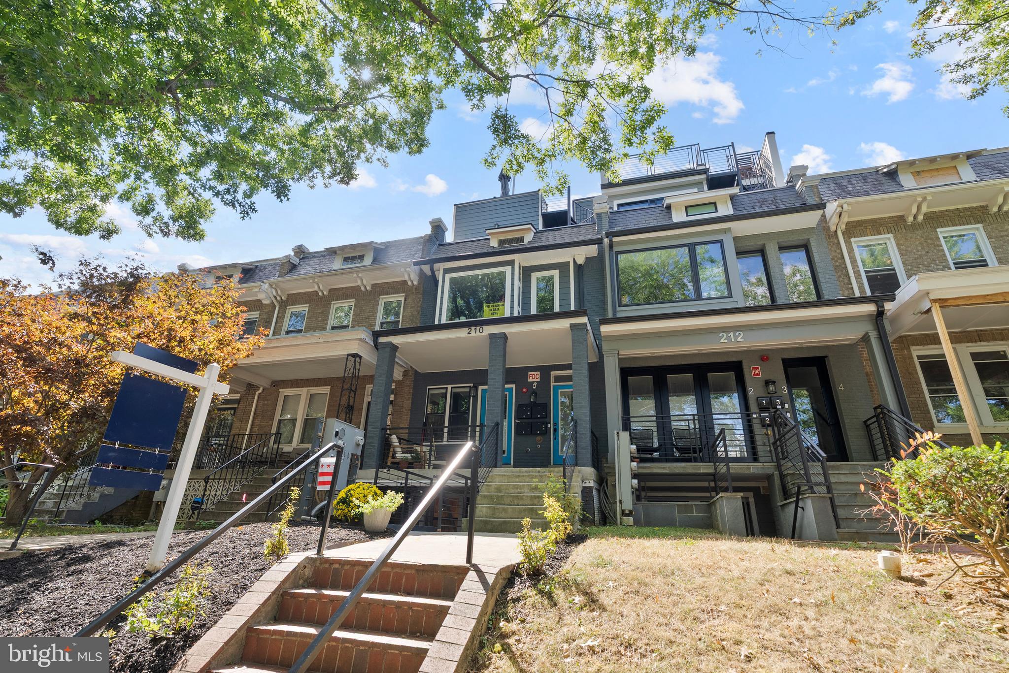 210 Varnum Street Northwest, Unit 1 Washington, DC 20011 - Photo 22 of 22 a view of a house with a yard
